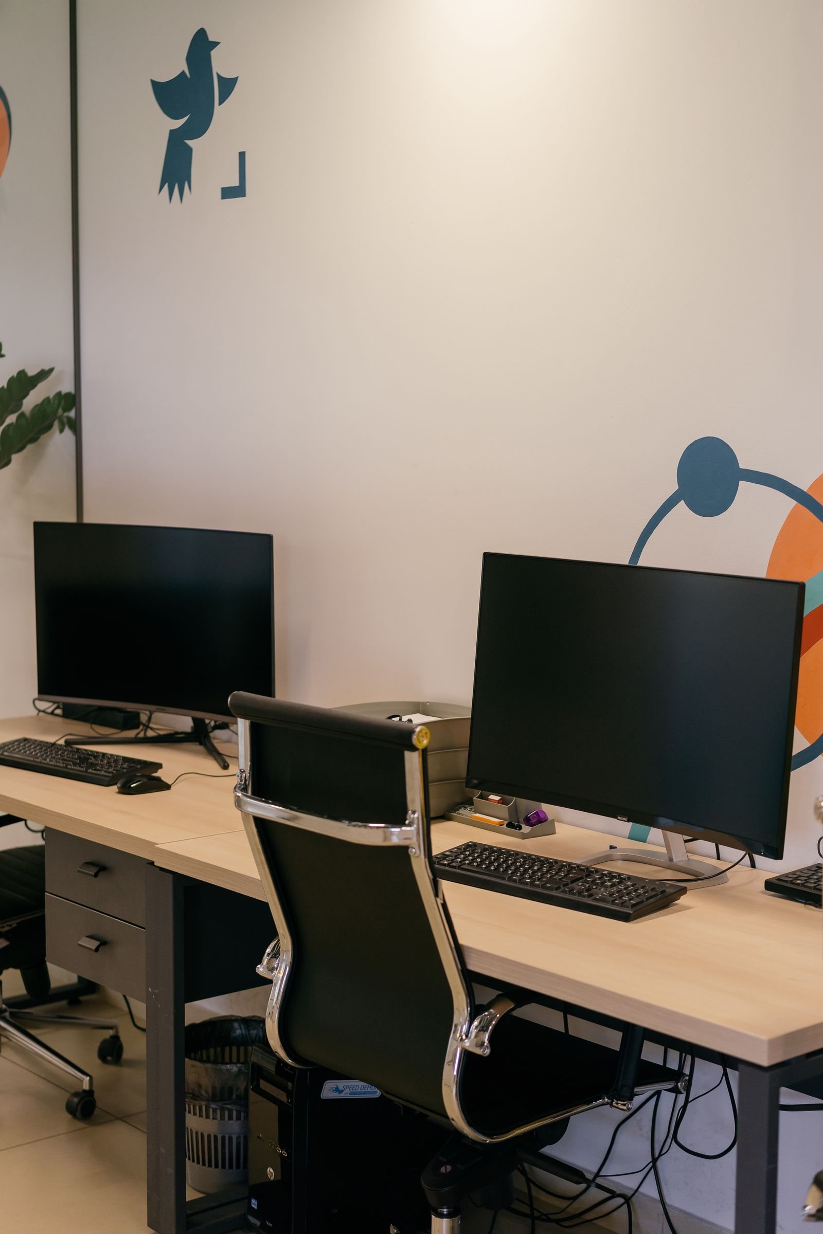 Home Desk with two monitors and a keyboard set up for work